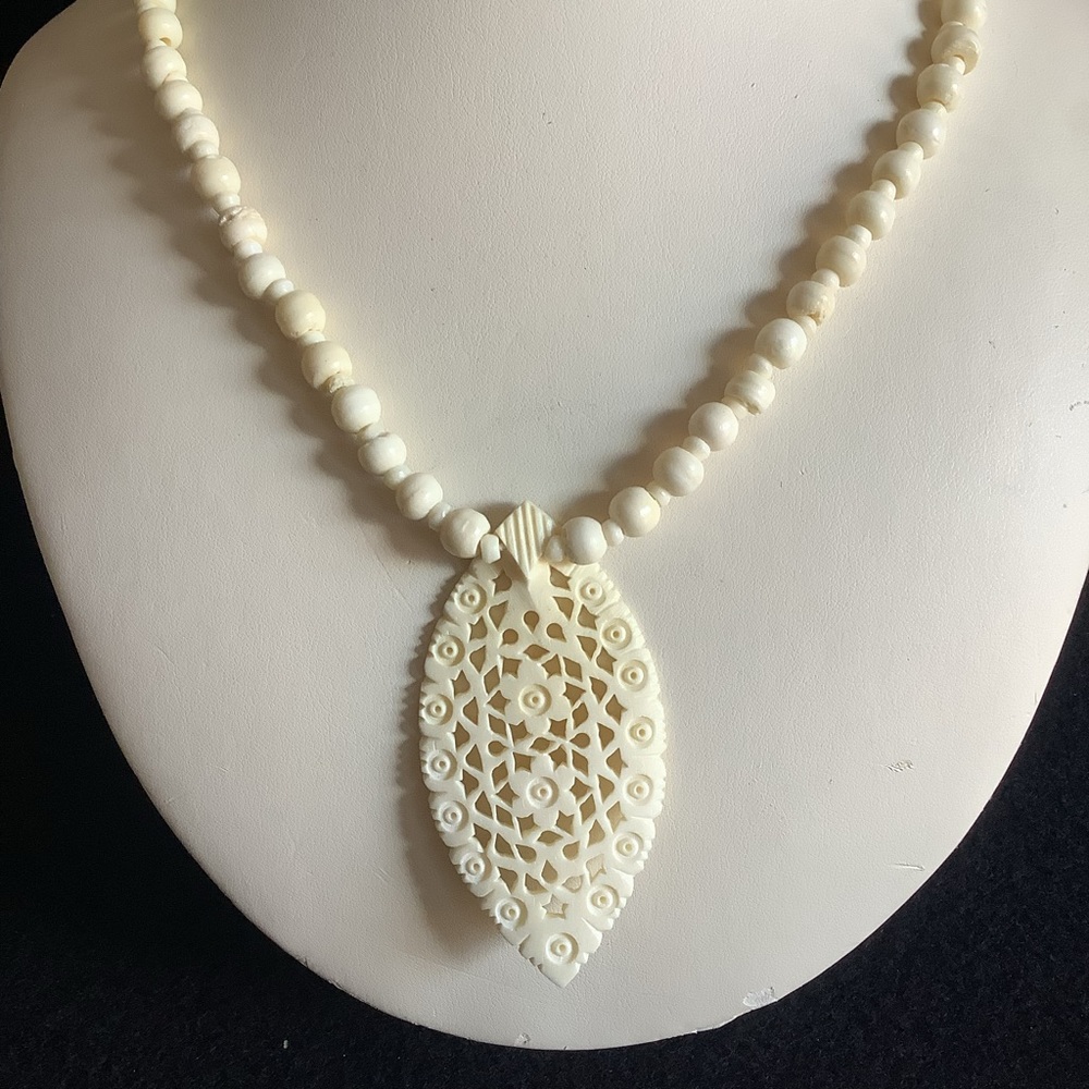 Vintage hand carved bone necklace.